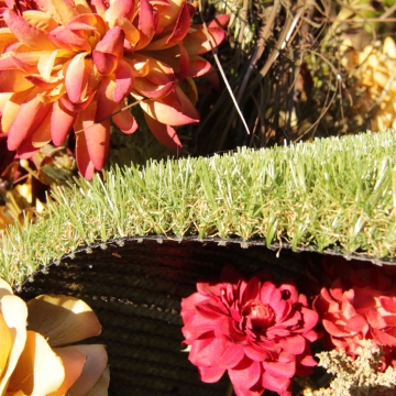 Synthetic grass, artificial turf, artificial plants flowers red white rose green olive brown turf backing drainage flowers background